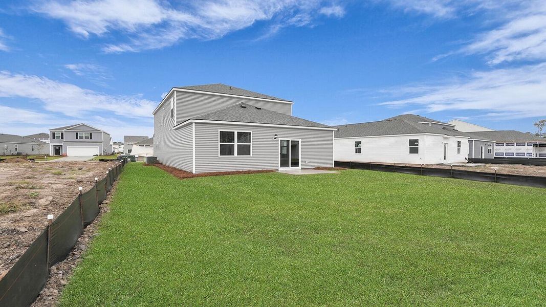 Exterior details and patio area of a home in Pine Hills at Cane Bay, Summerville (Image 2).