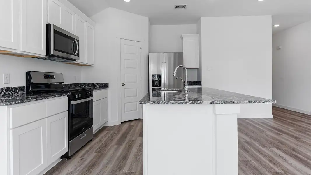 Furnished interior view inside a new home in Caldwell Crossing, Iowa Colony (Image 6). Furnished interior view inside a new home in Caldwell Crossing, Iowa Colony (Image 6).