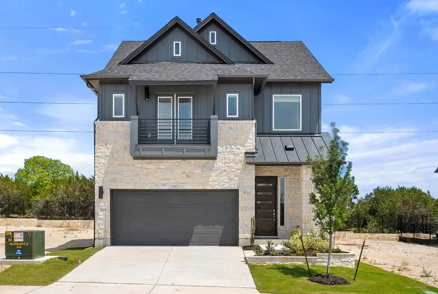 Front exterior of a new home in Foxfield, Austin, TX, highlighting curb appeal (Image 1). Front exterior of a new home in Foxfield, Austin, TX, highlighting curb appeal (Image 1).