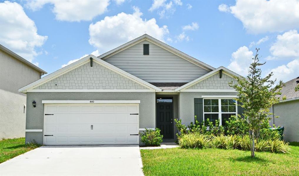 Front exterior of a new home in , Deland, FL, highlighting curb appeal (Image 2). Front exterior of a new home in , Deland, FL, highlighting curb appeal (Image 2).