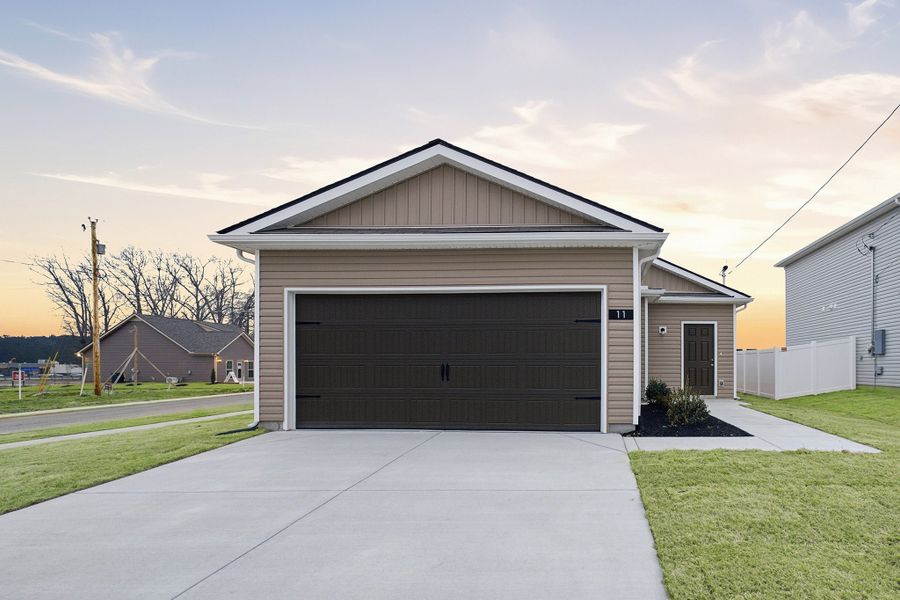 Front exterior of a new home in Stonehenge, Manchester, TN, highlighting curb appeal (Image 1). Front exterior of a new home in Stonehenge, Manchester, TN, highlighting curb appeal (Image 1).