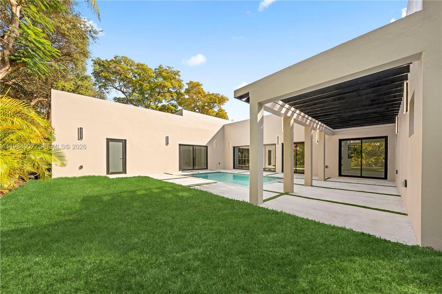 Exterior details and patio area of a home in , North Miami (Image 36).