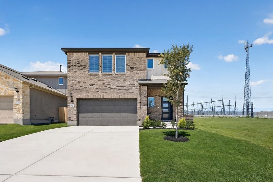 Front exterior of a new home in Sunfield, Buda, TX, highlighting curb appeal (Image 26).