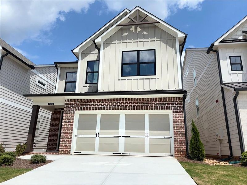 Front exterior of a new home in , Marietta, GA, highlighting curb appeal (Image 2). Front exterior of a new home in , Marietta, GA, highlighting curb appeal (Image 2).