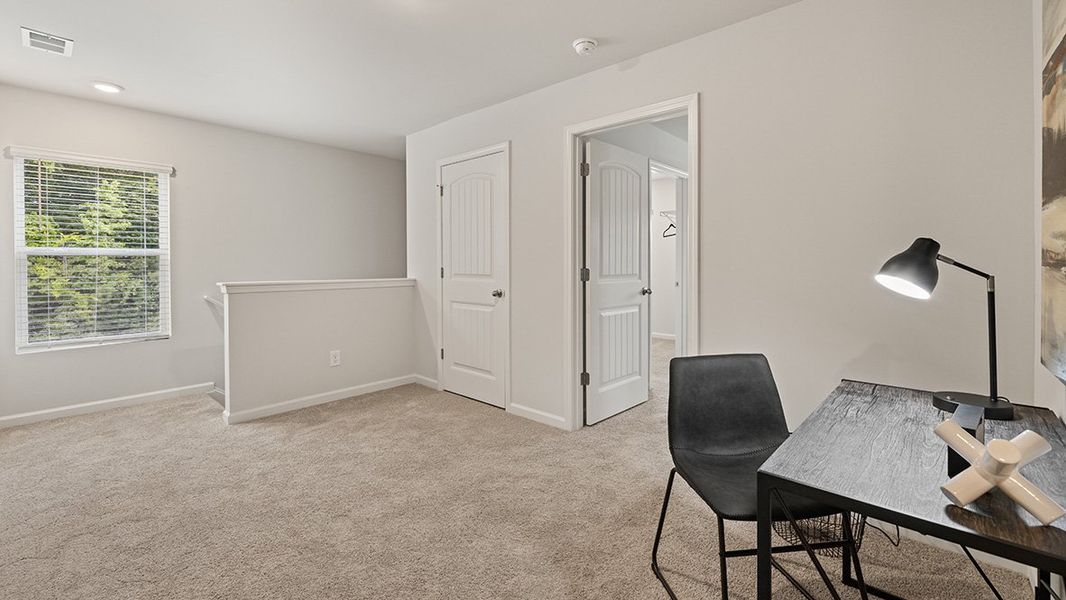 Representative furnished interior of a home built from the ROBIE by D.R. Horton in Pointe Park, Union City (Image 29).