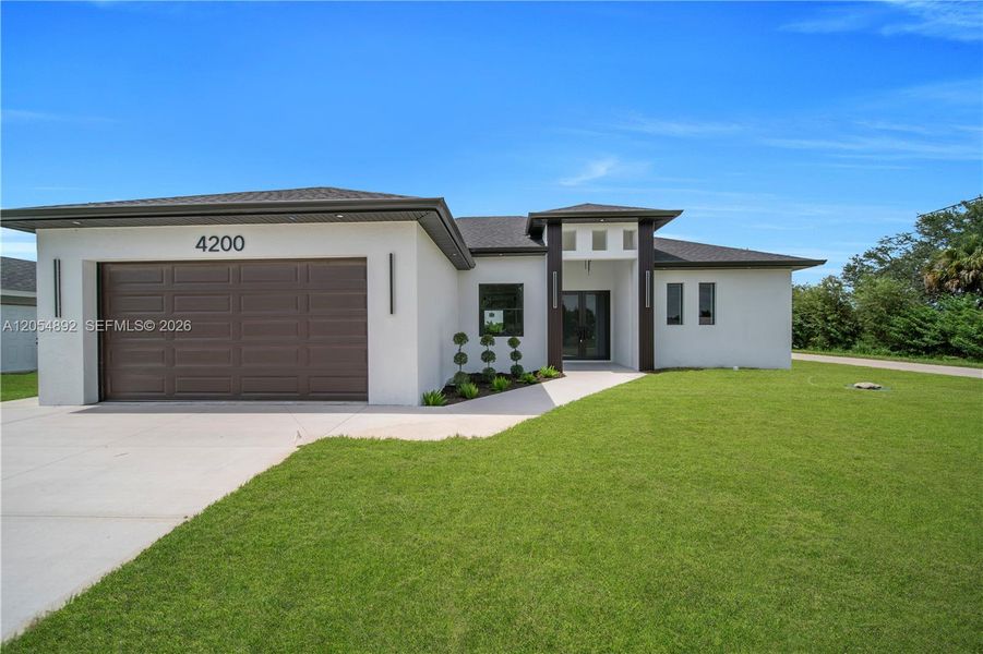 Front exterior of a new home in , Lehigh Acres, FL, highlighting curb appeal (Image 1). Front exterior of a new home in , Lehigh Acres, FL, highlighting curb appeal (Image 1).