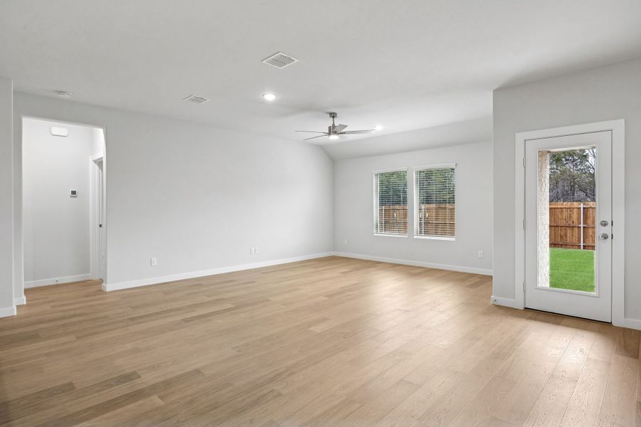 Living and Dining Room in the Heisman home plan by Trophy Signature Homes – REPRESENTATIVE PHOTO