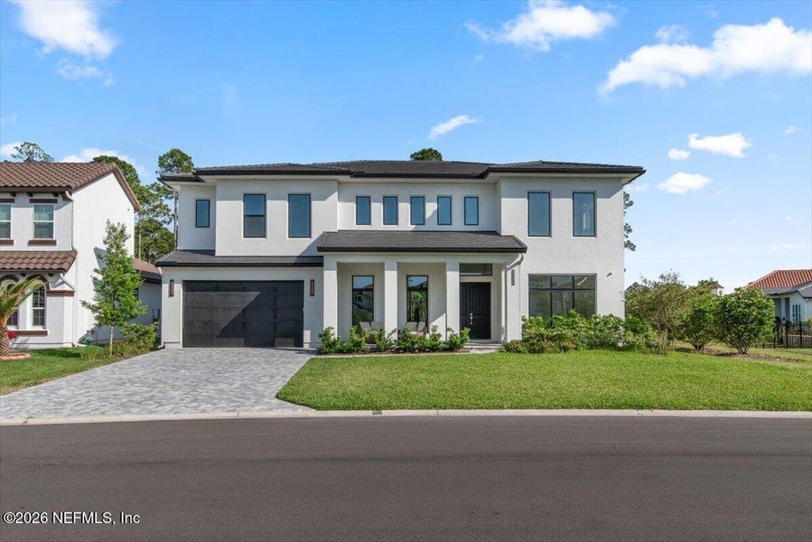 Front exterior of a new home in Tamaya, Jacksonville, FL, highlighting curb appeal (Image 29).