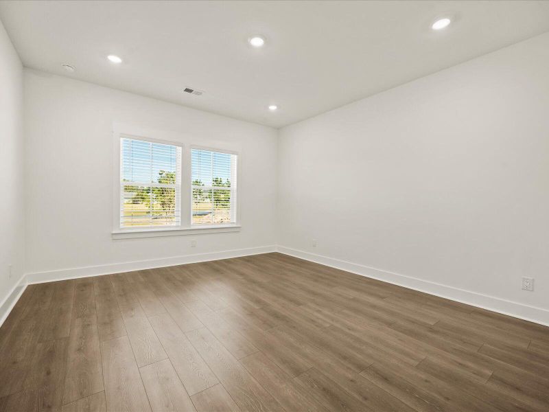 Spacious, unfurnished interior of a new home in The Coves at Lakes of Cane Bay, Summerville (Image 21).