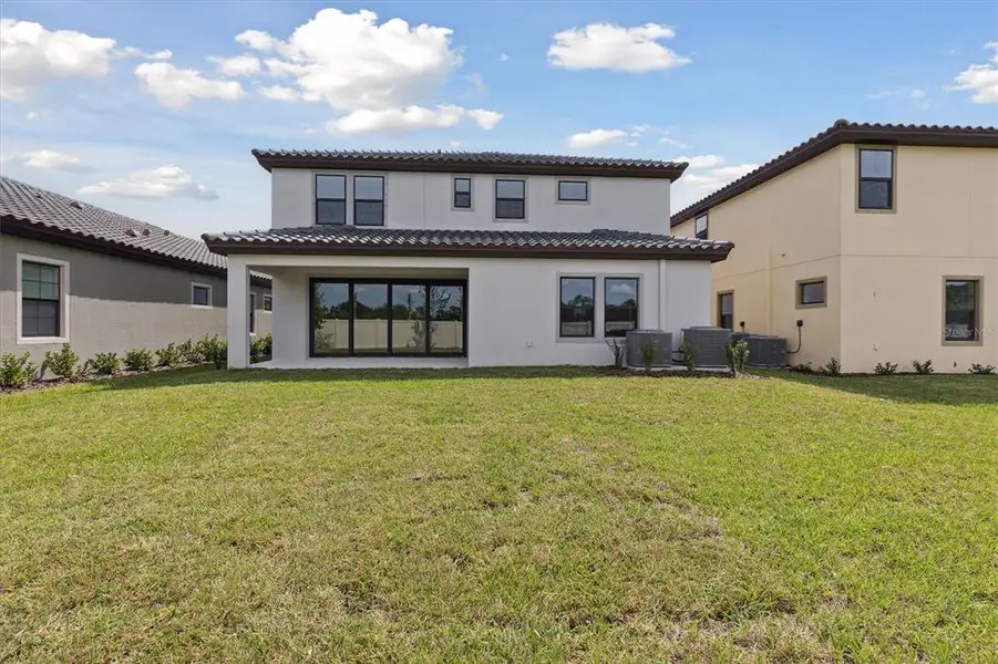 Exterior details and patio area of a home in Crosswind Ranch, Parrish (Image 2). Exterior details and patio area of a home in Crosswind Ranch, Parrish (Image 2).