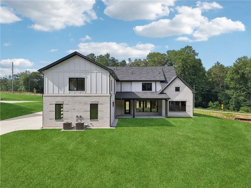 Front exterior of a new home in , Braselton, GA, highlighting curb appeal (Image 52).