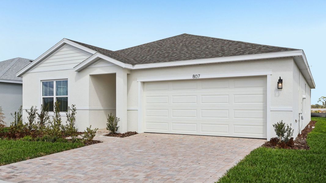 Representative exterior photo of a completed home built from the Baker by DRB Homes in Liberty Trace, Haines City, FL (Image 21).