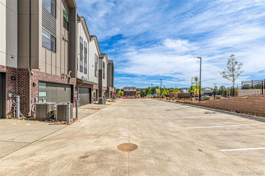 Front exterior of a new home in Ascent at Inverness, Englewood, CO, highlighting curb appeal (Image 1).