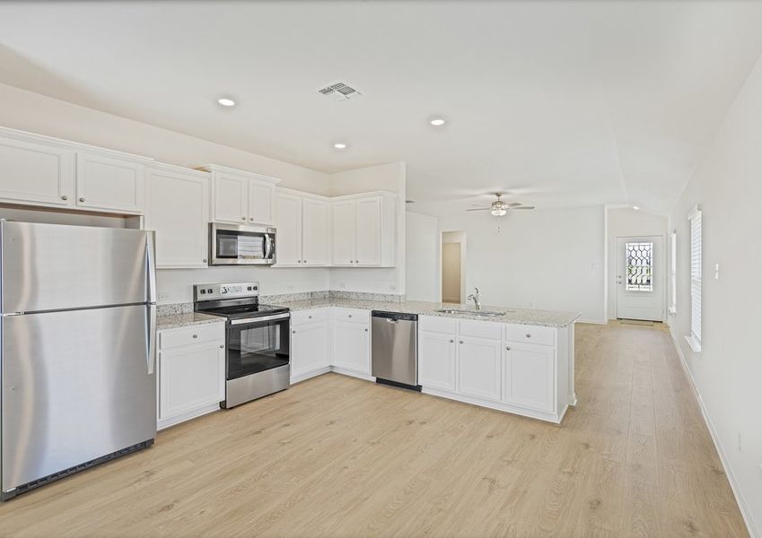 Chef-ready kitchen with white cabinets and stainless steel appliances