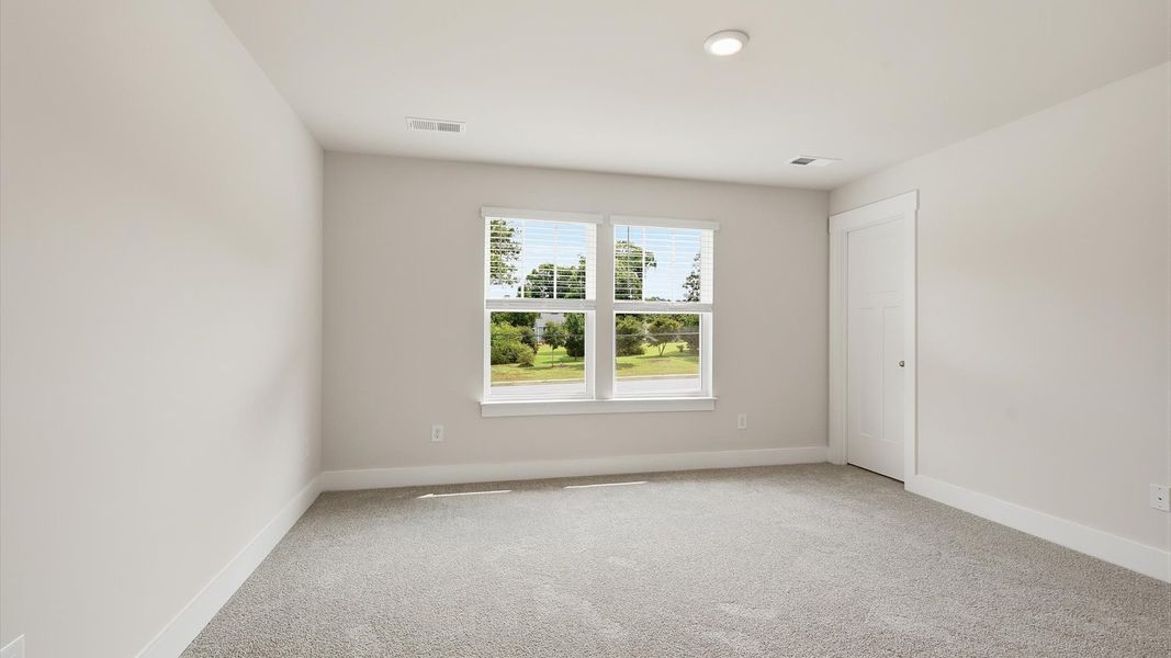 Memorable mornings begin in this tasteful and thoughtfully crafted primary suite at Clarke Townes