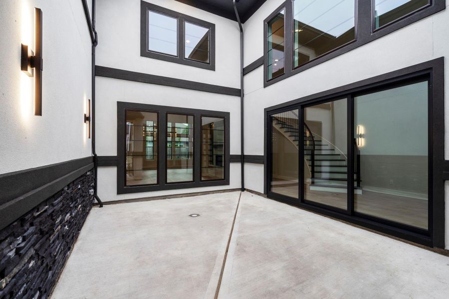 The open-air courtyard is this homes most distinguishing feature. Imagine how comfortable and inviting this outdoor living space is when furnished!