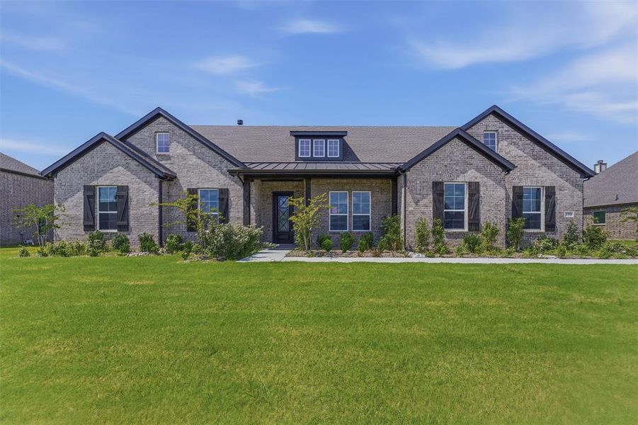Expansive front lawn with a walkway leading to the inviting covered porch Expansive front lawn with a walkway leading to the inviting covered porch