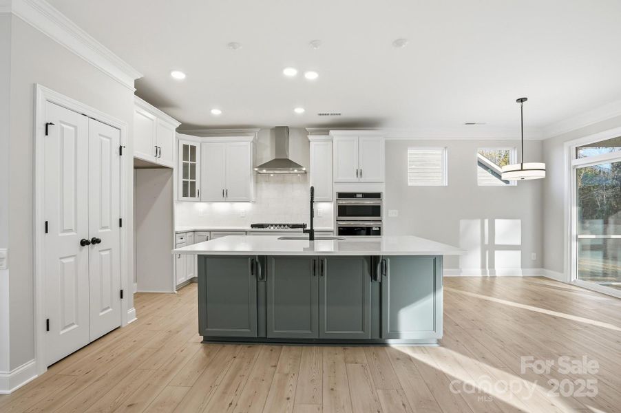 Kitchen with quartz countertops and two toned cabinets