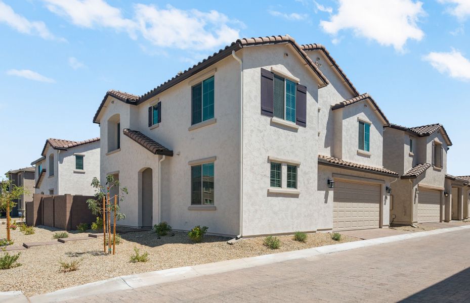 Front exterior of a new home in Asante- Atrium Series, Surprise, AZ, highlighting curb appeal (Image 2).