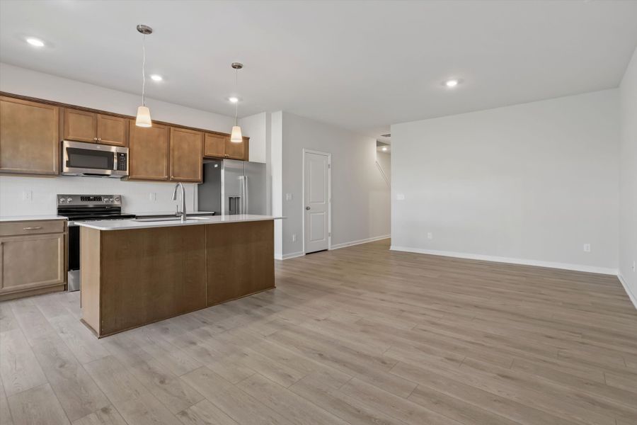 Furnished interior view inside a new home in West Main Townhomes, Sanford (Image 5).
