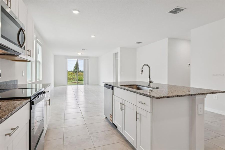 Furnished interior view inside a new home in Lake Deer Estates - Signature Series, Poinciana (Image 9).
