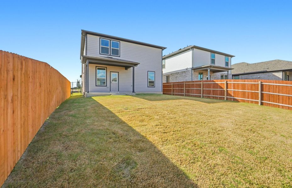 Exterior details and patio area of a home in Saddleback at Santa Rita Ranch, Liberty Hill (Image 22).