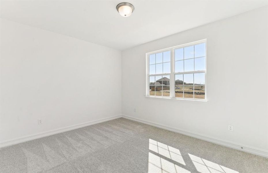 Comfortable bedroom with closet and large window Comfortable bedroom with closet and large window