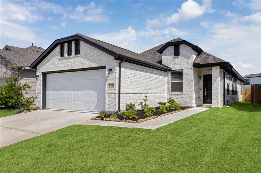Front exterior of a new home in Sandrock Station, Houston, TX, highlighting curb appeal (Image 2). Front exterior of a new home in Sandrock Station, Houston, TX, highlighting curb appeal (Image 2).