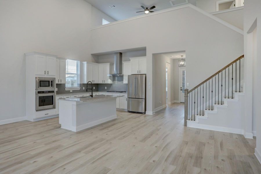 Furnished interior view inside a new home in ShadowGlen, Manor (Image 5).
