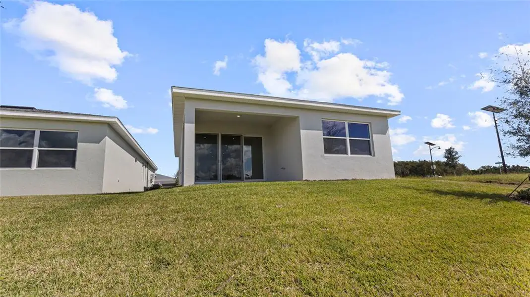 Exterior details and patio area of a home in Cresswind at Hammock Oaks, Lady Lake (Image 4).