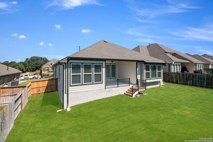 Front exterior of a new home in Foxbrook, Cibolo, TX, highlighting curb appeal (Image 16). Front exterior of a new home in Foxbrook, Cibolo, TX, highlighting curb appeal (Image 16).