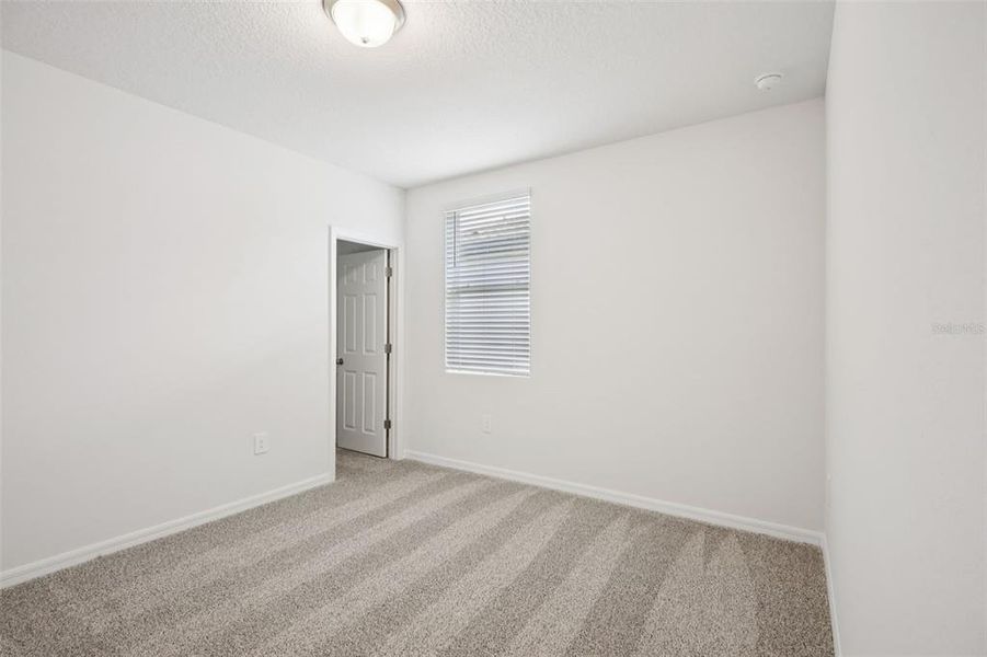 Spacious, unfurnished interior of a new home in Villamar - Signature Series, Winter Haven (Image 18).