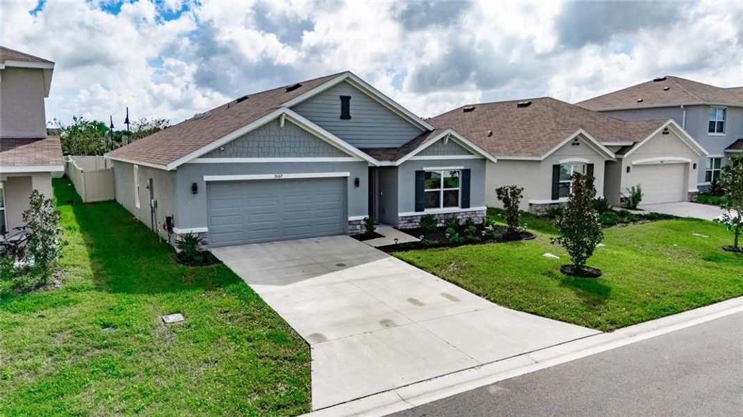 Front exterior of a new home in North Park Isle, Plant City, FL, highlighting curb appeal (Image 24).