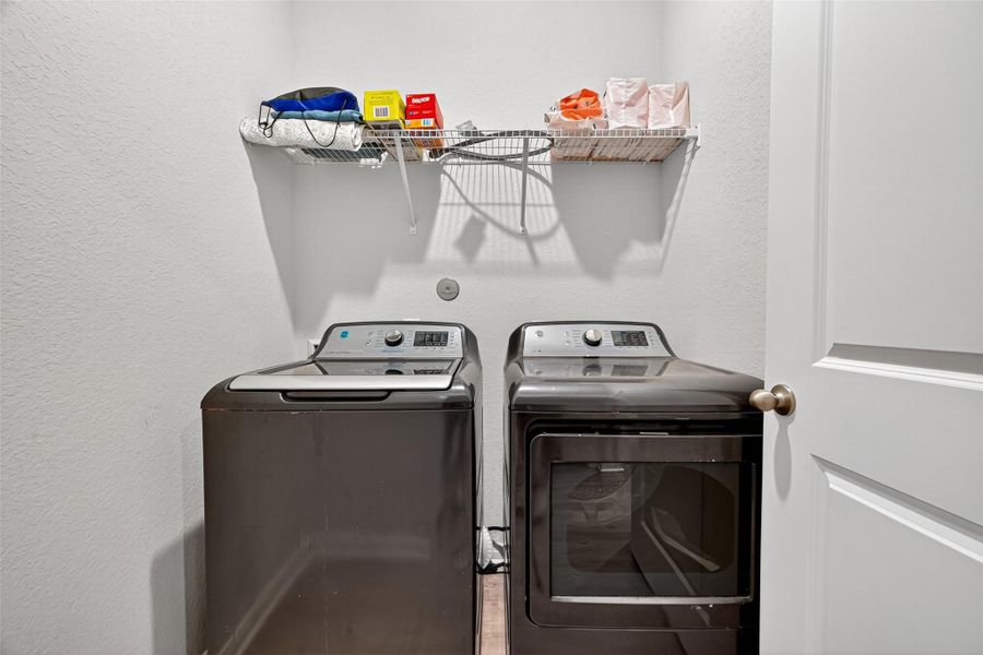 Walk in utility room located in house. Walk in utility room located in house.