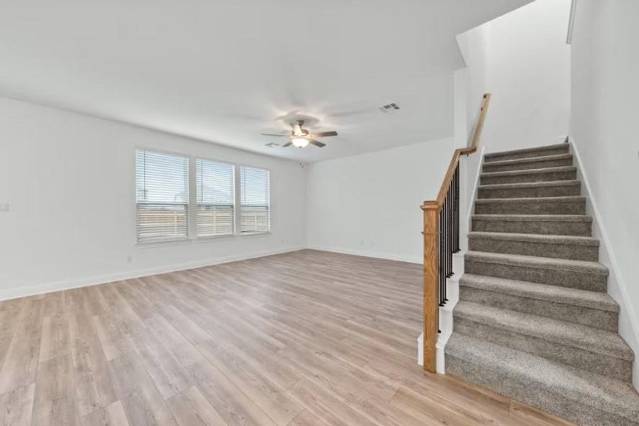 Photo of Pulte model home with same floor plan, not of actual home listed.