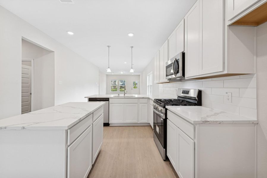 The Cardinal II- Kitchen. Photos of home shown are for illustration only; actual features, colors, and upgrades may vary. The Cardinal II- Kitchen. Photos of home shown are for illustration only; actual features, colors, and upgrades may vary.