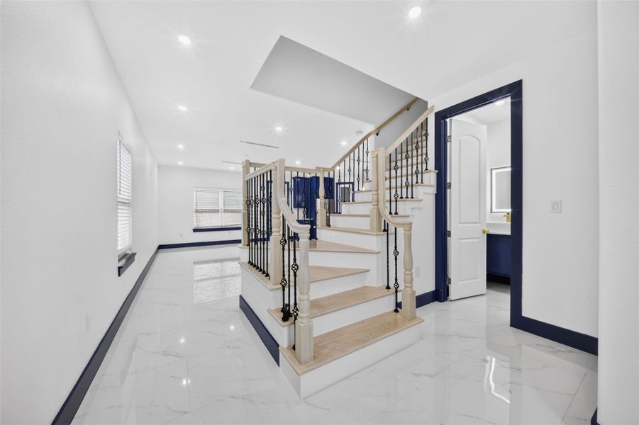 Open foyer showcases the staircase and easy flow into the main living spaces