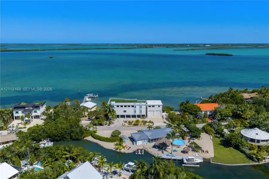 Waterfront residence featuring direct deep-water access, a private boat slip, a heated swimming pool, and a rooftop terrace Waterfront residence featuring direct deep-water access, a private boat slip, a heated swimming pool, and a rooftop terrace