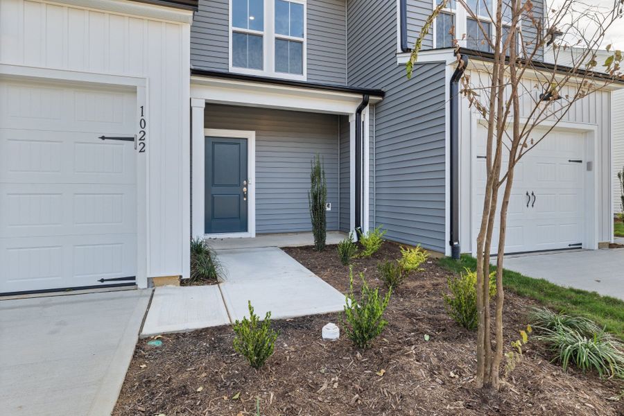 Exterior details and patio area of a home in Poets Walk, Whitsett (Image 4).