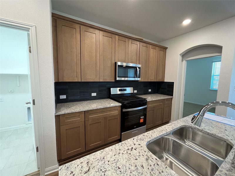 Furnished interior view inside a new home in Wellspring, Round Rock (Image 6).