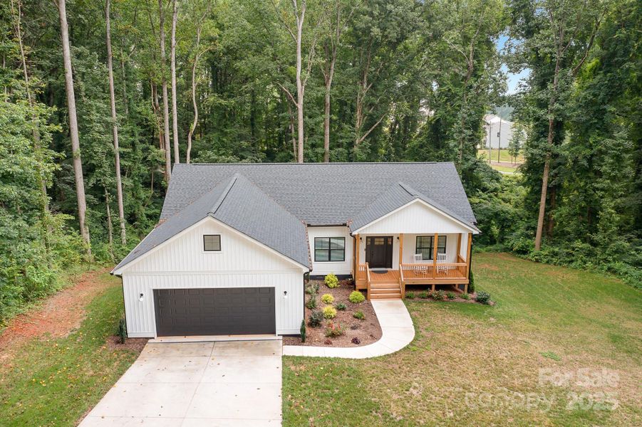 Front exterior of a new home in , Statesville, NC, highlighting curb appeal (Image 23).