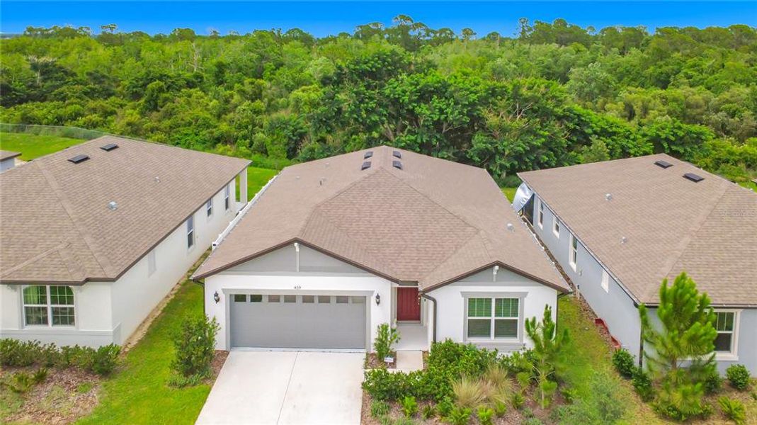 Front exterior of a new home in Lake Alfred Pines, Lake Alfred, FL, highlighting curb appeal (Image 22).