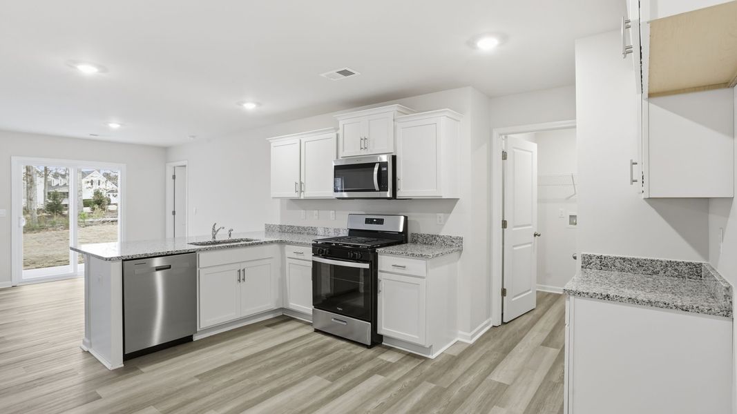 Furnished interior view inside a new home in Bentley Park, Greenwood (Image 7).