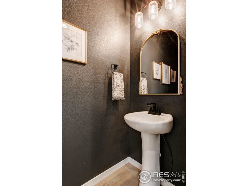 Powder bath. Upgraded plumbing hardware throughout the home.