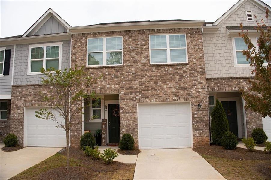 Front exterior of a new home in , Palmetto, GA, highlighting curb appeal (Image 1). Front exterior of a new home in , Palmetto, GA, highlighting curb appeal (Image 1).