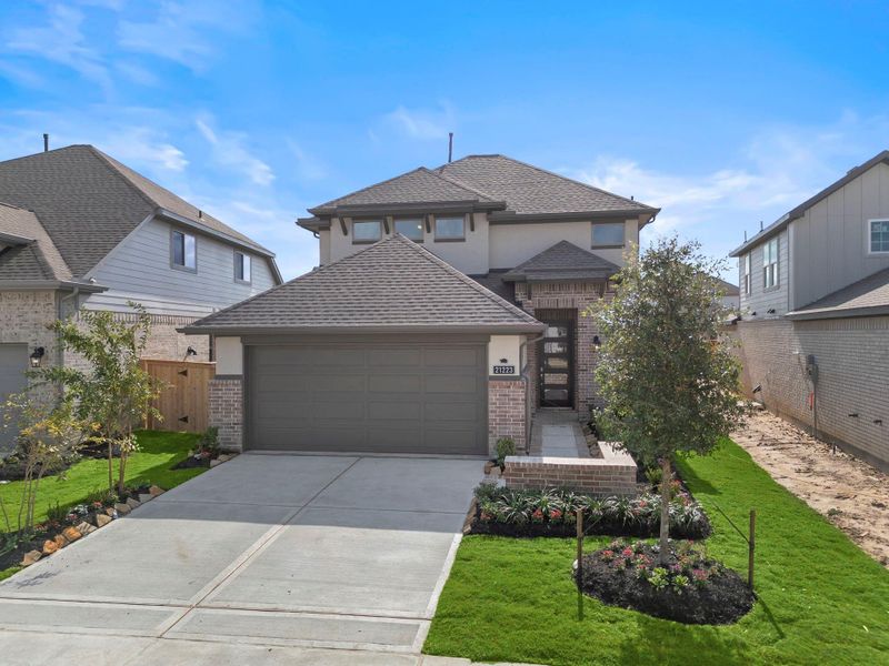 Front exterior of a new home in Bridgeland 40', Cypress, TX, highlighting curb appeal (Image 2).