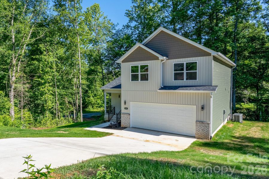 Front exterior of a new home in , Dallas, NC, highlighting curb appeal (Image 25).