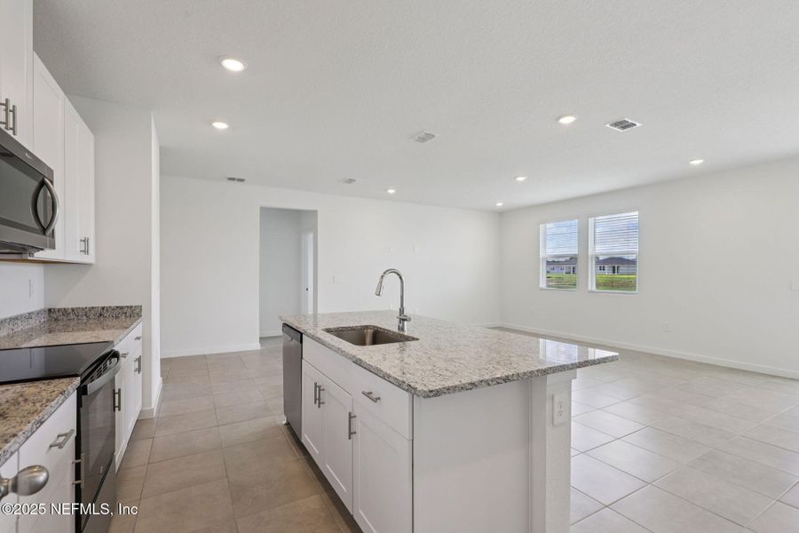 Furnished interior view inside a new home in Lakes at Bella Lago - Signature Series, Green Cove Springs (Image 4). Furnished interior view inside a new home in Lakes at Bella Lago - Signature Series, Green Cove Springs (Image 4).
