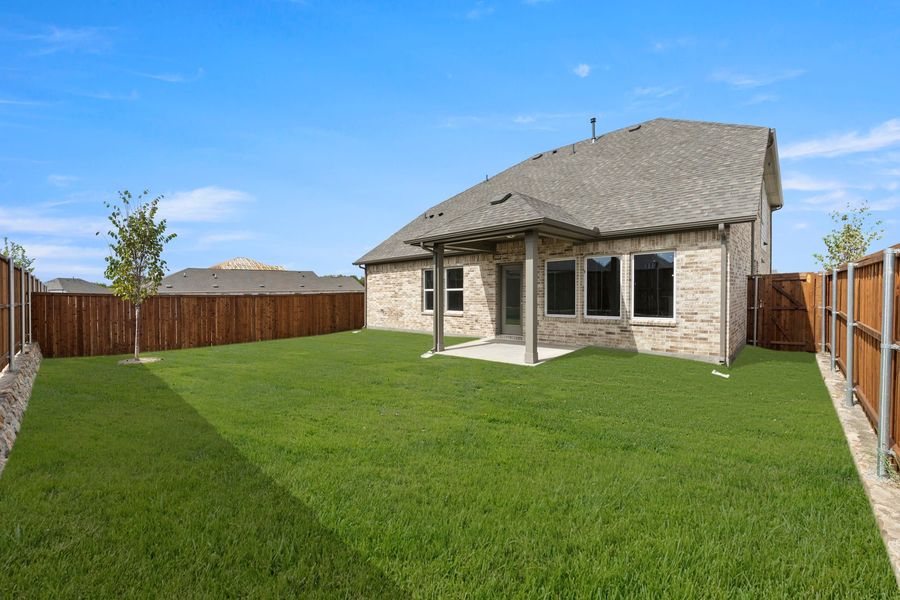 Exterior details and patio area of a home in Creekside, Royse City (Image 2).