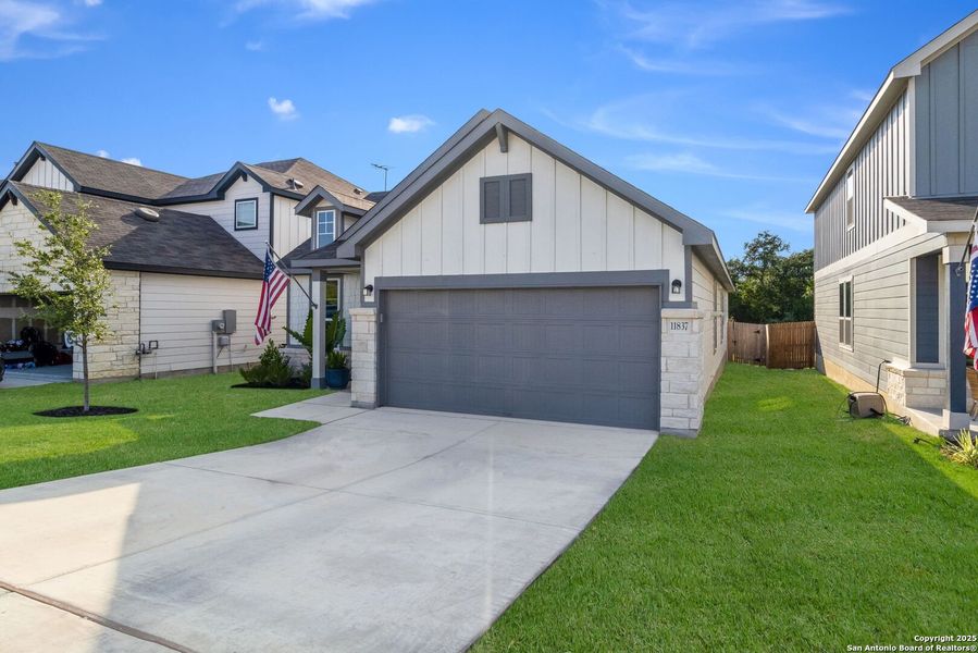 Front exterior of a new home in Davis Ranch, San Antonio, TX, highlighting curb appeal (Image 20).